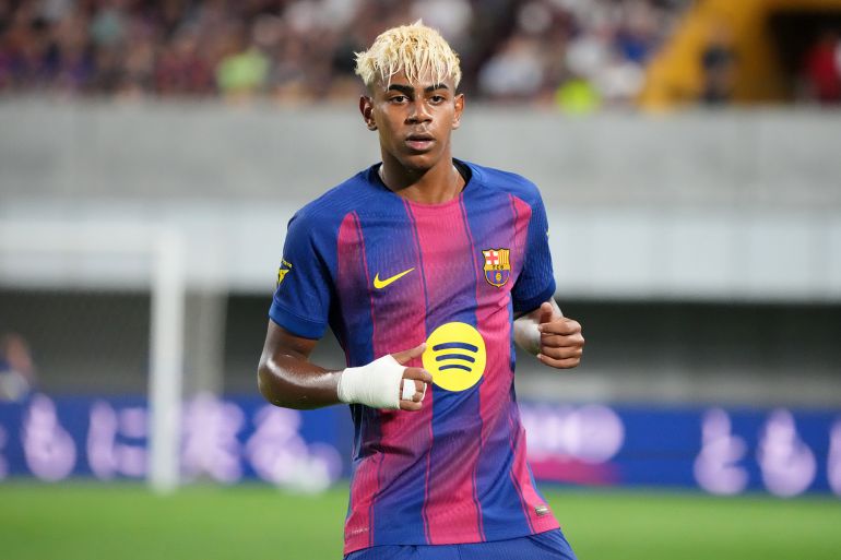 KOBE, JAPAN - JULY 27: Lamine Yamal of FC Barcelona looks on during the preseason friendly between Vissel Kobe and FC Barcelona at Noevir Stadium Kobe on July 27, 2025 in Kobe, Hyogo, Japan. (Photo by Koji Watanabe/Getty Images)