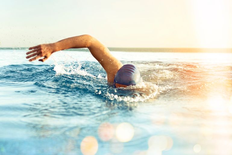 Man Swimming outdoors