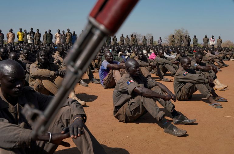 South Sudan soldiers gather at the training site for the joint force to protect VIPs in Gorom outside Juba