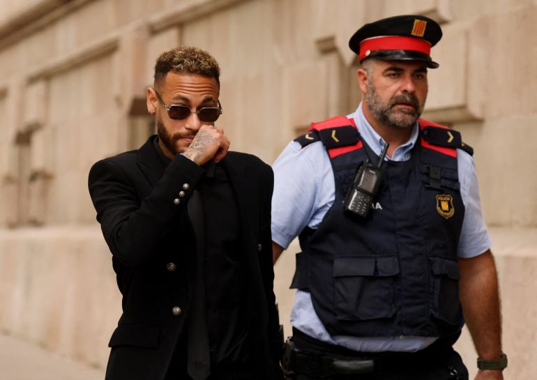 Brazil's Neymar to stand trial in a corruption case over his transfer to FC Barcelona