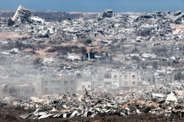 Destroyed buildings in the Gaza Strip are pictured from a position along Israel's southern border with the besieged Palestinian territory on August 5, 2025.