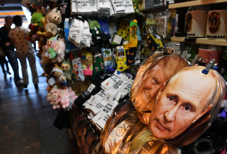 Masks of Russia's President Vladimir Putin and US President Donald Trump are displayed for sale in Saint Petersburg on August 7, 2025.