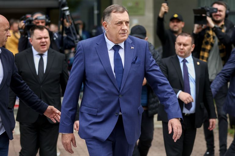 Bosnian Serb President Milorad Dodik, walks to his car after the opening ceremony of the rectory building in Istocno Sarajevo, Bosnia, Thursday, April 24, 2025. (AP Photo/Armin Durgut)