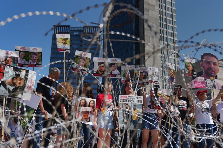 Families of hostages protest, demanding the release from Hamas captivity in the Gaza Strip, at the plaza known as the hostages square in Tel Aviv, Israel, Saturday, Aug. 2, 2025. (AP Photo/Ariel Schalit)