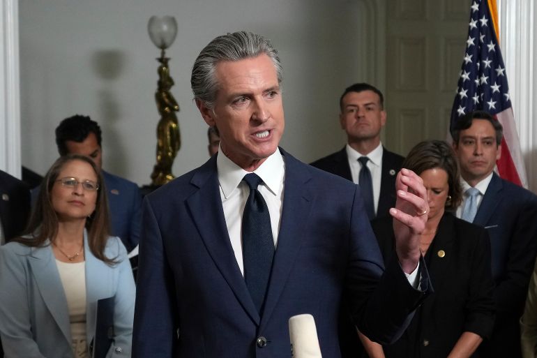 Accompanied by California and Texas lawmakers, California Gov. Gavin Newsom speaks in support of the Texas Democratic lawmakers for their walk out to block a vote on a congressional redistricting plan sought by President Donald Trump, during a news conference in Sacramento, Calif., Friday Aug. 8, 2025. (AP Photo/Rich Pedroncelli)