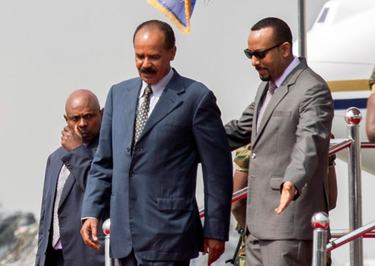 FILE - In this Saturday, July 14, 2018 file photo, Eritrean President Isaias Afwerki, left, is welcomed by Ethiopia's Prime Minister Abiy Ahmed upon his arrival at Addis Ababa International Airport, Ethiopia. The 2019 Nobel Peace has been awarded to Ethiopian Prime Minister Abiy Ahmed. Ahmed was cited for his efforts to achieve peace and international cooperation, and in particular for his decisive initiative to resolve the border conflict with neighbouring Eritrea. (AP Photo Mulugeta Ayene, File)