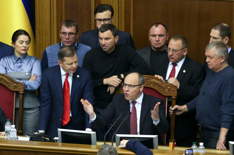 FILE - Ukrainian lawmakers listen to parliament speaker Andriy Parubiy, center, during a parliament session in Kiev, Ukraine, Monday, Nov. 26, 2018. (AP Photo/Efrem Lukatsky, file)