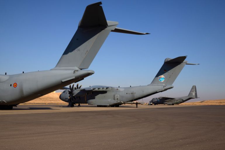 epa12285610 A German Air Force plane (C) on the tarmac prior to a mission to air drop humanitarian aid over the Gaza Strip, at a military base in Jordan, 06 August 2025. Two planes were scheduled to take off from Jordan on 06 August to release humanitarian aid as part of an ongoing multi-country aid effort. EPA/SIMA DIAB
