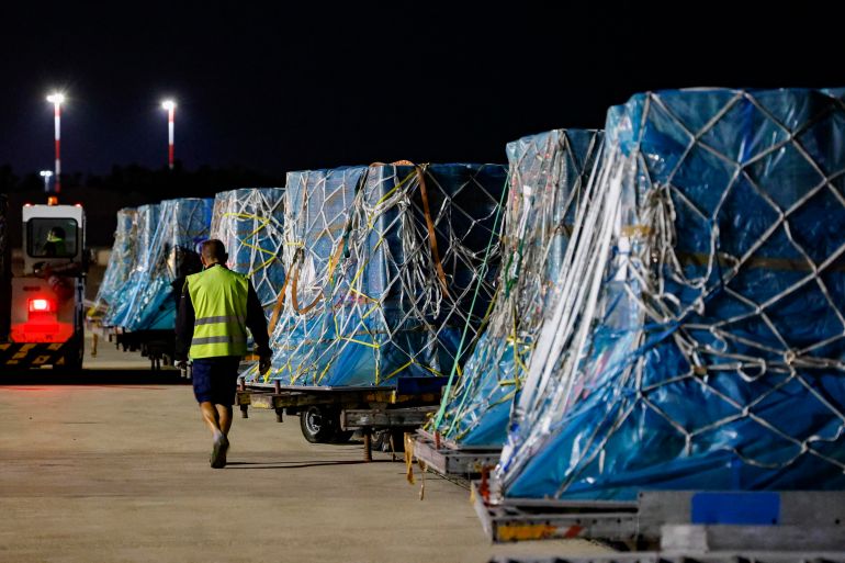 epa12289381 Boxes with humanitarian aid from the 'Food for Gaza' initiative are prepared for shipment in a transport aircraft at Fiumicino Airport, in Rome, Italy, 08 August 2025. EPA/FABIO FRUSTACI