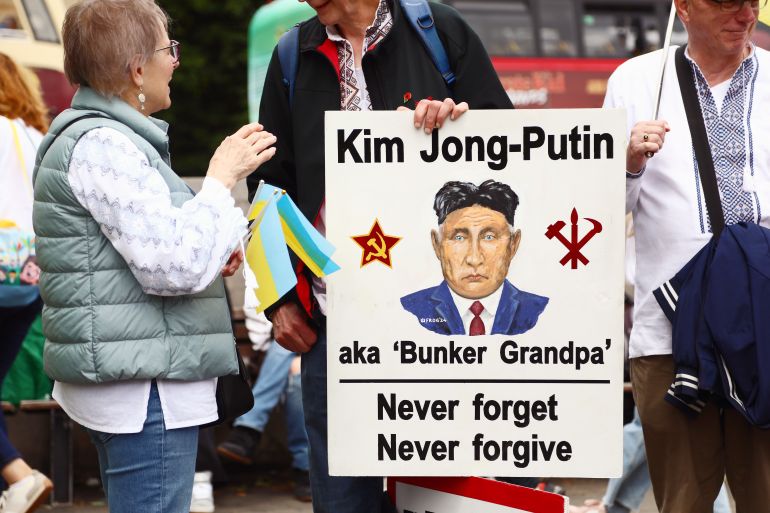 LONDON, ENGLAND - MAY 24: Protestors, with a sign reading "Kim Jong-Putin" gather to demand the return of the Ukrainian children abducted by Russia on May 24, 2025 in London, England. According to the Ukrainian government, more than 19,500 children have been forcibly taken by Russia since the beginning of the full-scale invasion of Ukraine. To date, only 1,307 of these children have been safely returned to areas under Ukrainian government control. (Photo by Alishia Abodunde/Getty Images)