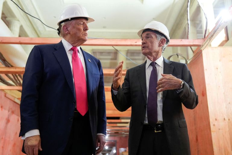 U.S. President Donald Trump and Federal Reserve Chair Jerome Powell speak during a tour of the Federal Reserve Board building, which is currently undergoing renovations, in Washington, D.C., U.S., July 24, 2025. REUTERS/Kent Nishimura