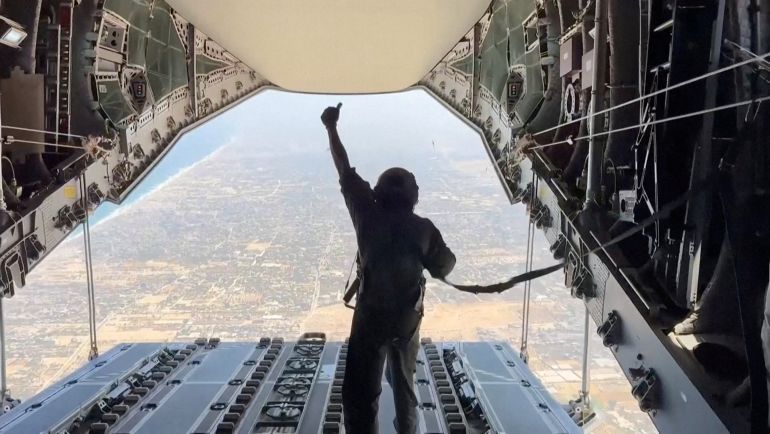 Spanish military personnel gives a thumbs up after humanitarian aid was dropped over the Gaza Strip from a Spanish aircraft, August 1, 2025, in this screengrab from video. Spanish Defence Ministry/Handout via REUTERS THIS IMAGE HAS BEEN SUPPLIED BY A THIRD PARTY TPX IMAGES OF THE DAY