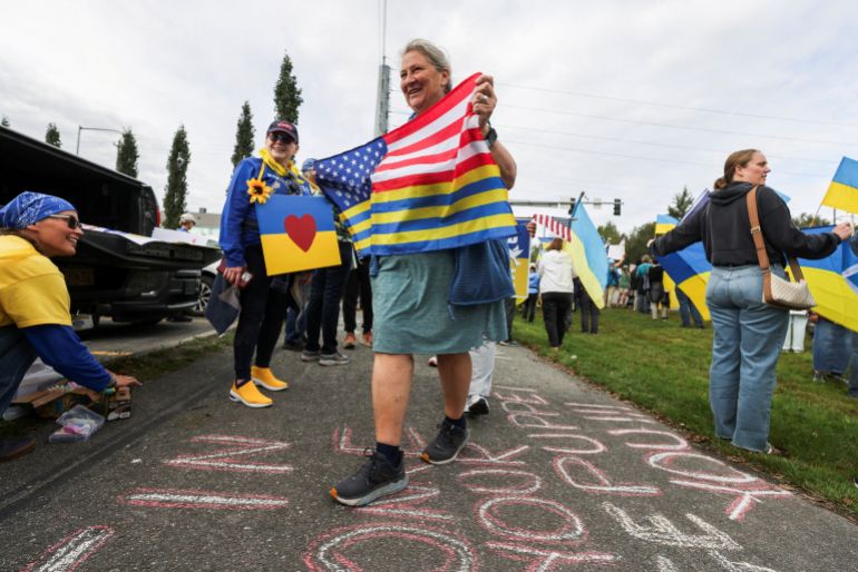 Demonstrators attend a protest in solidarity with Ukraine, ahead of the meeting between U.S. President Donald Trump and Russian President Vladimir Putin, in Anchorage, Alaska, U.S., August 14, 2025. REUTERS/Nathaniel Wilder