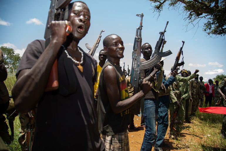 Rebels of the Sudan People's Liberation Movement-in-Opposition (SPLM-IO), a South Sudanese anti-government force, take part in a military exercise at a base in Panyume, on the South Sudanese side of the border with Uganda, on September 22, 2018. Despite a peace deal being signed by the President of South Sudan, Salva Kiir, and opposition leader Riek Machar on September 12, conflict in Central Equatoria continues as both warring parties fight for control. (Photo by SUMY SADURNI / AFP)