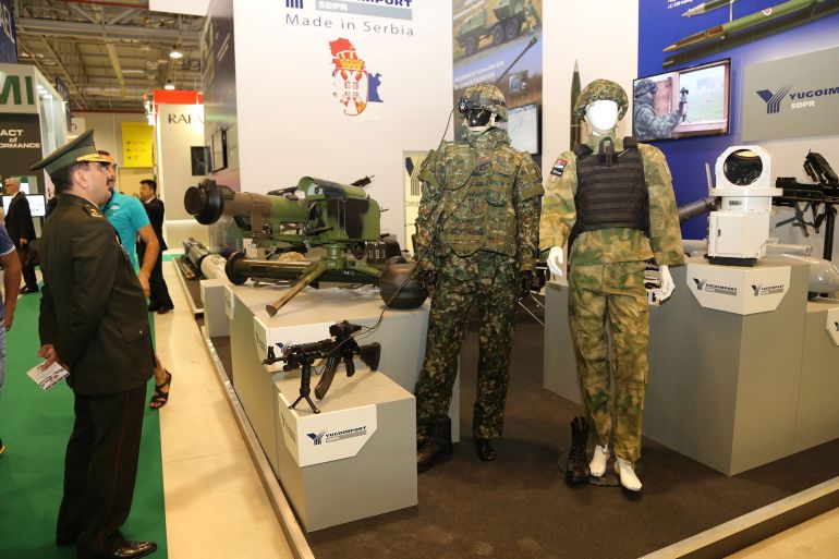 BAKU, AZERBAIJAN - SEPTEMBER 11: Visitors examine products of Serbian Yugoimport SDPR Defence Company during Azerbaijan International Defense Industry Exhibition at the Baku Expo Center in Baku, Azerbaijan on September 11, 2014. The Azerbaijan International Defense Industry Exhibition (ADEX 2014) takes place for the first time from the 11th to 13th September at the Baku Expo Center. (Photo by Resul Rehimov/Anadolu Agency/Getty Images)