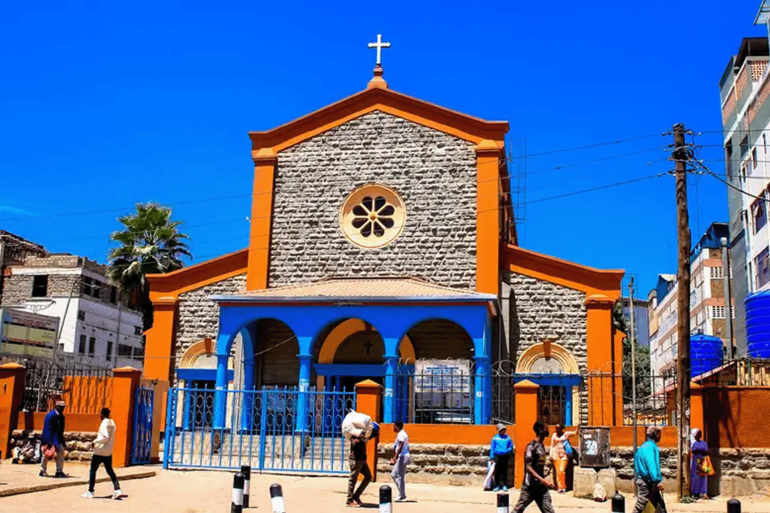 Pedestrians walk past St. Peters Clavers Catholic Church on... NAIROBI, KENYA - 2023/02/13: Pedestrians walk past St. Peters Clavers Catholic Church on Uyoma Street in Central Business District. Central Business District in Nairobi is the center of the city's commercial activities, making it a suitable environment for investors and entrepreneurs to build their businesses, commercial spaces, and offices. Hence, it has become one of the city's tourist attractions. (Photo by Donwilson Odhiambo/SOPA Images/LightRocket via Getty Images)