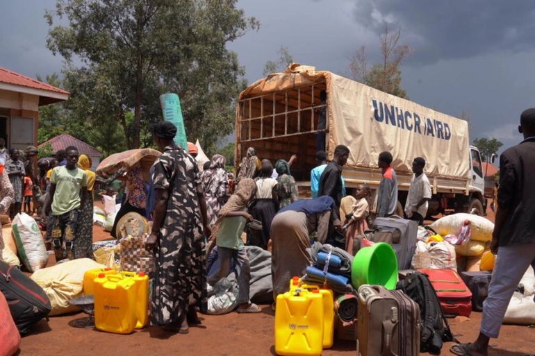 Sudanese new arrivals offload their luggage from a UNHCR truck at the Kiryandongo Reception Centre in northwestern Uganda. UNHCR/Ssozi Mukasa Daniel