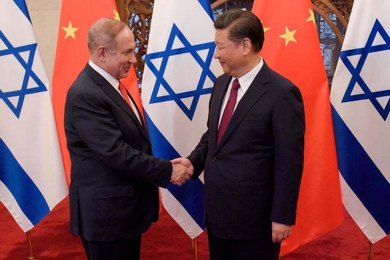 Chinese President Xi Jinping and Israeli Prime Minister Benjamin Netanyahu shake hands ahead of their talks at Diaoyutai State Guesthouse in Beijing, China