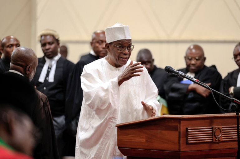 Maurice Kamto (C), whose candidacy was not retained by Elections Cameroon (ELECAM) gestures as he attends the appeals hearing at the Constitutional Council, in Yaounde on August 4, 2025.
